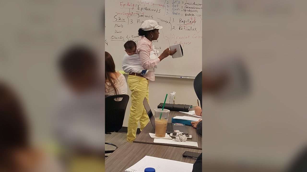 1569762590 ga professor holds baby