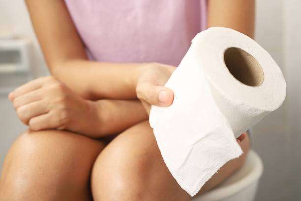 1690123887 woman sitting in the bathroom holding toilet paper